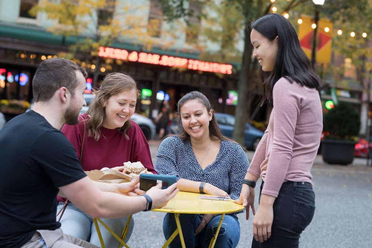 Students gather outside of primanti brothers enjoying time off campus.